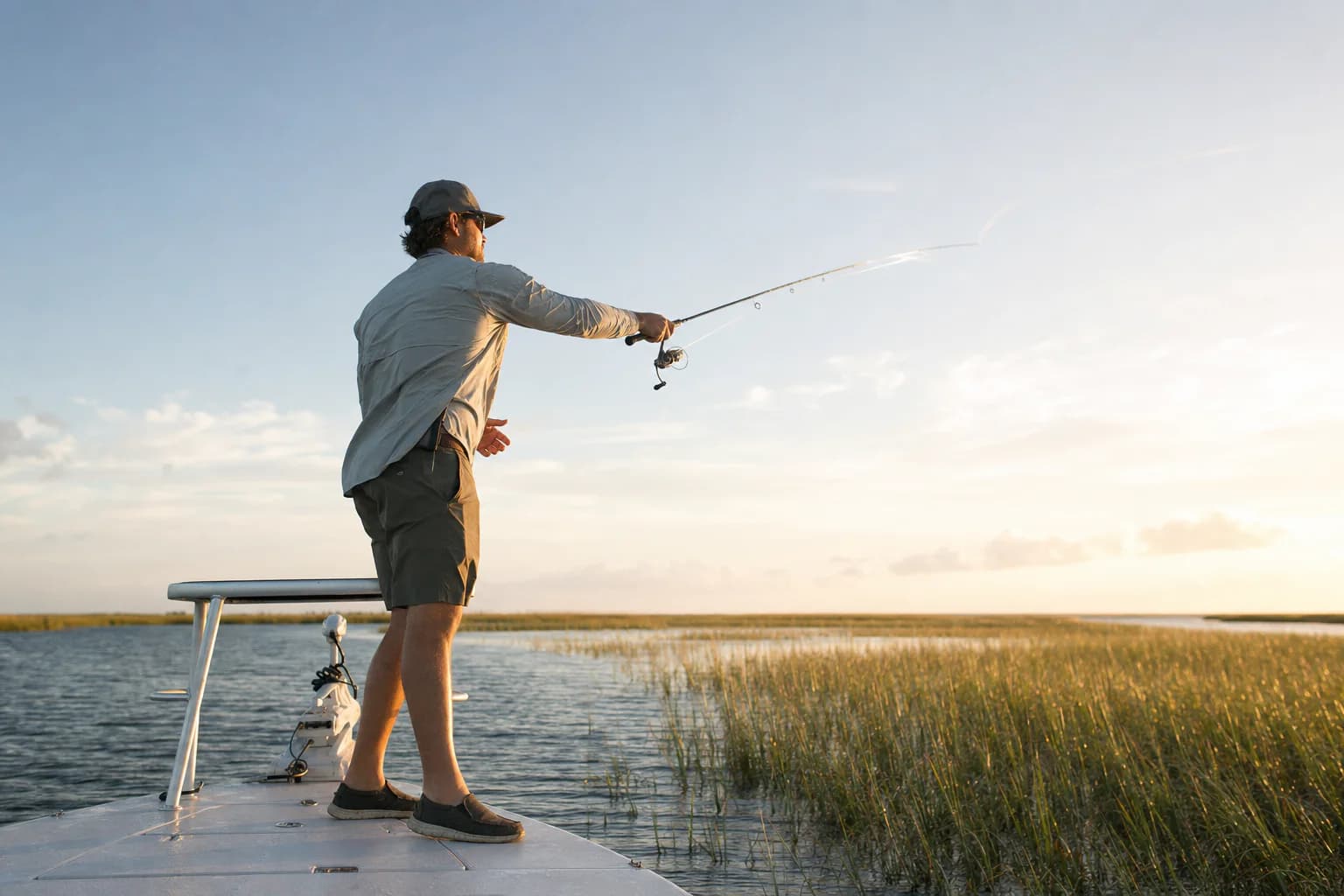 Inshore angler presenting a lure across a coastal flat