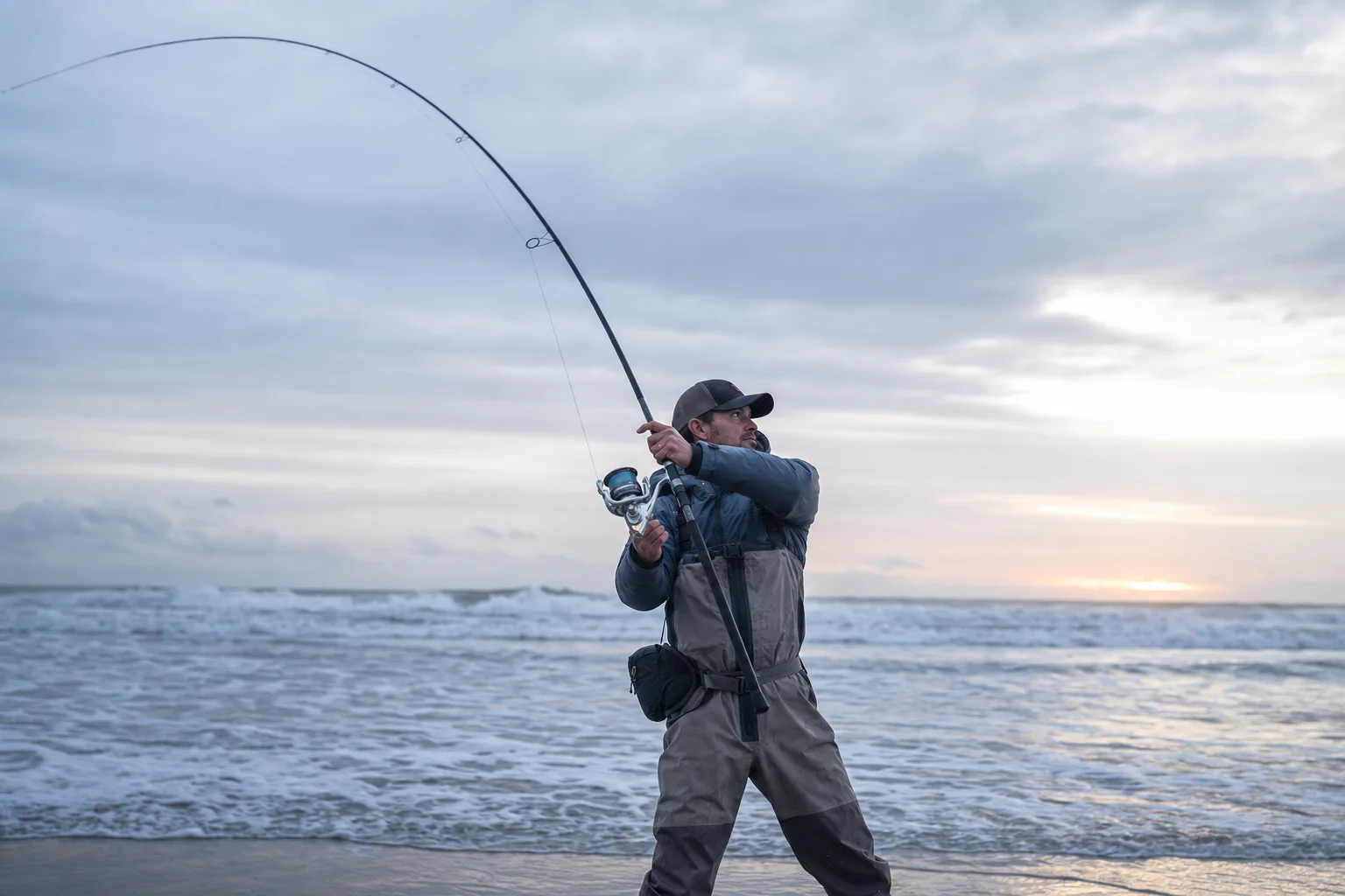 Long coastal rod working a cast from an open shoreline
